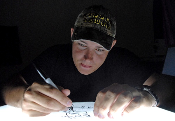Air Force cartoonist publishes book while deployed